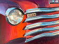 Original oil painting of a late-1940s Chevrolet truck, chrome grill and headlight bathed in golden hour light